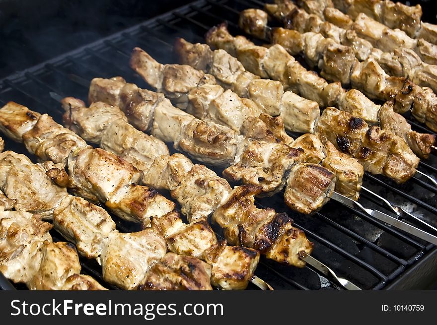 Meat on the skewers (shish kabob) grilling on the barbeque