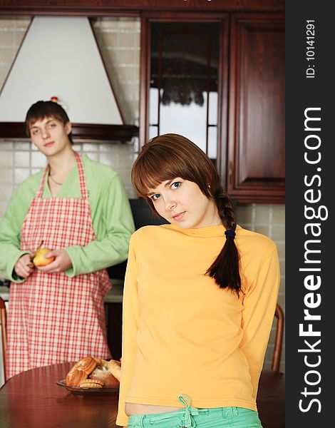 Happy young couple on a kitchen at home.