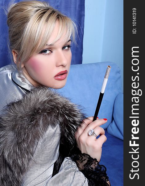 Girl with fur and cigarette. Girl with fur and cigarette