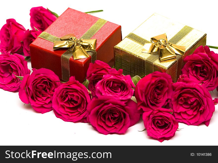 Golden gift boxes with red roses