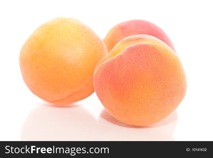 Small group of apricots isolated on a whitebackground