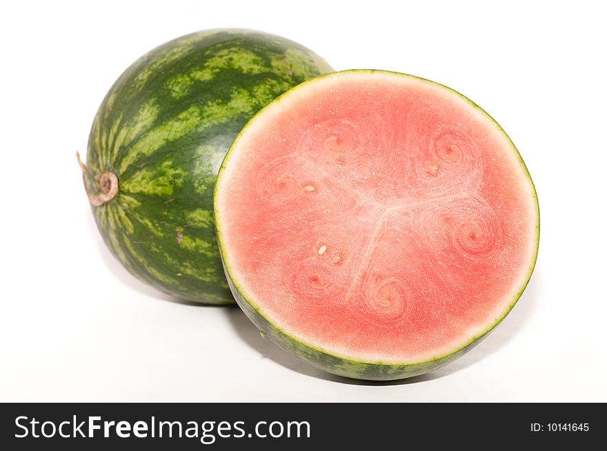 Cross section of a lovely, fresh watermelon isolated on a white background. Cross section of a lovely, fresh watermelon isolated on a white background