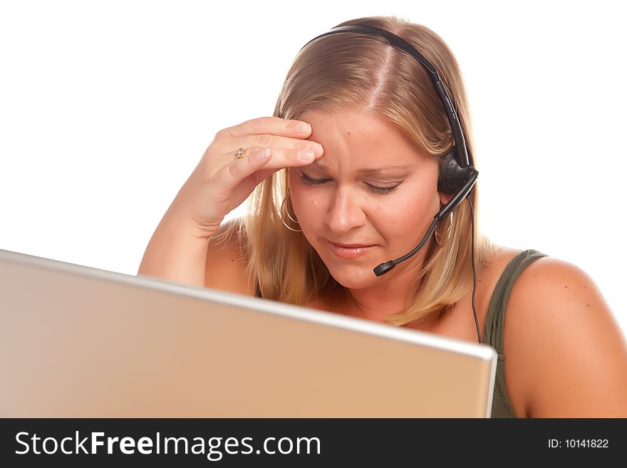 Fatigued Businesswoman with Hand on Her Head Talks on Her Phone Headset. Fatigued Businesswoman with Hand on Her Head Talks on Her Phone Headset.