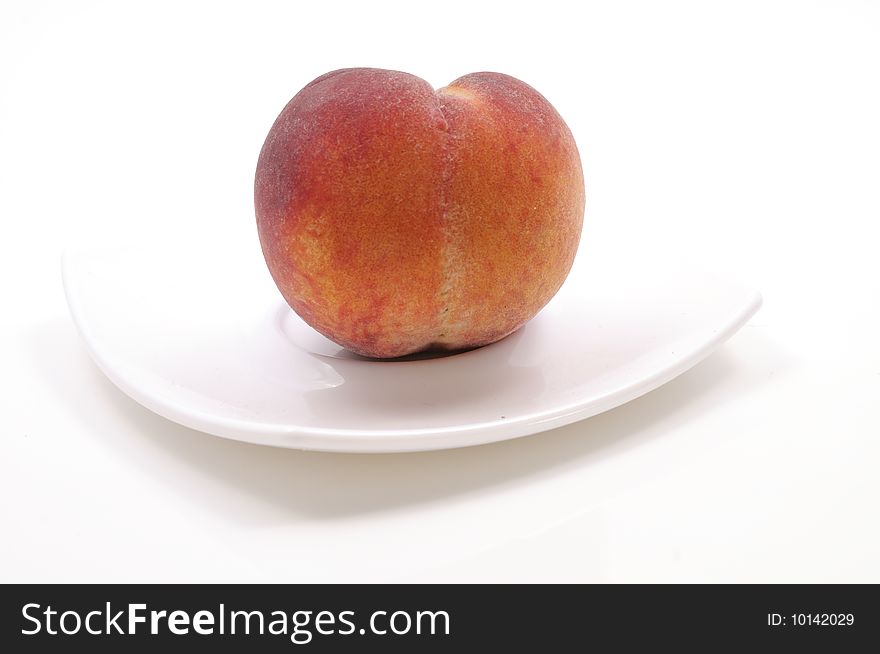 Fresh peach on white plate. Fresh peach on white plate.