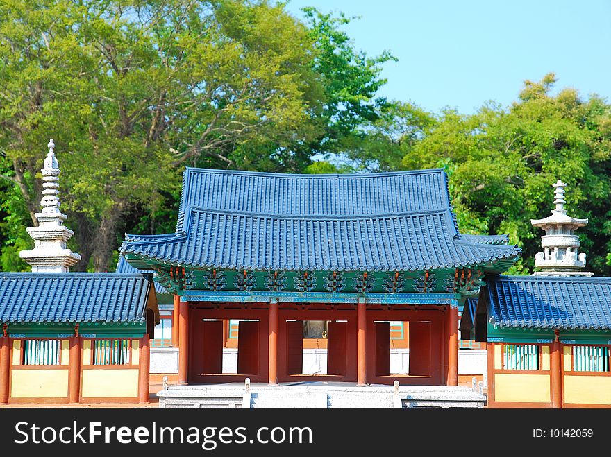 Front view of temple architecture surrounded with nature