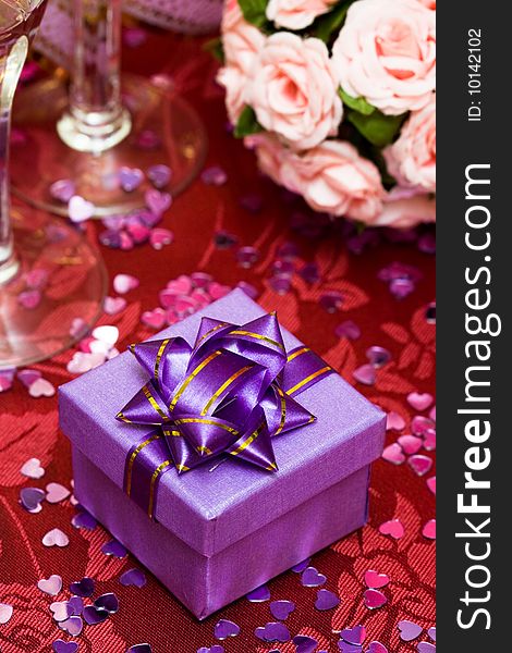 Gift box with bow and glass