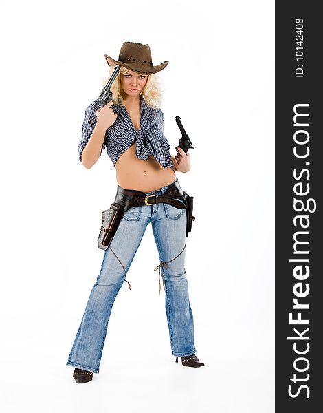 Young blonde woman in cowboy clothes with guns. Young blonde woman in cowboy clothes with guns