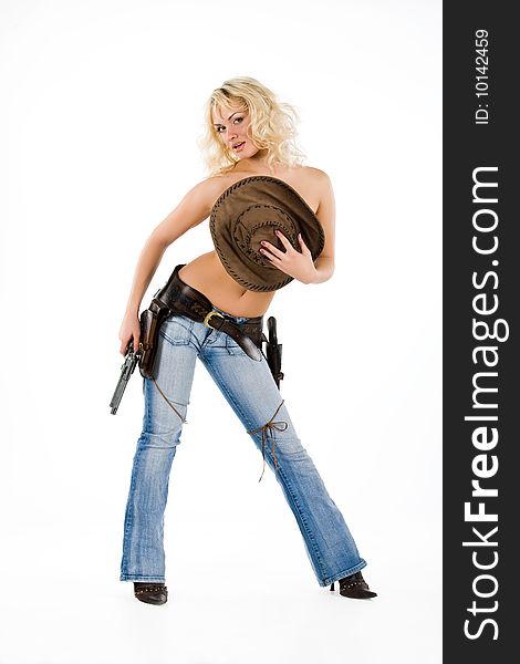 Young blonde woman in cowboy clothes with guns. Young blonde woman in cowboy clothes with guns