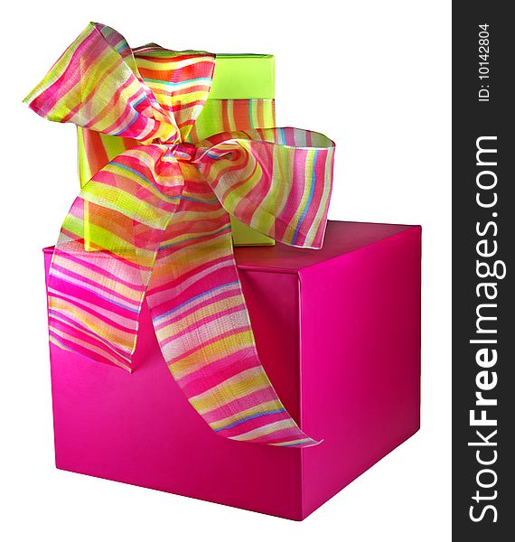 Pink and green gift boxes stacked, the top tied with sheer striped ribbon. Pink and green gift boxes stacked, the top tied with sheer striped ribbon