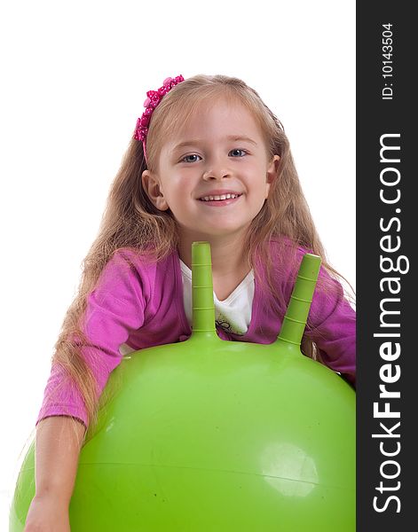 Little girl and big green ball on white background