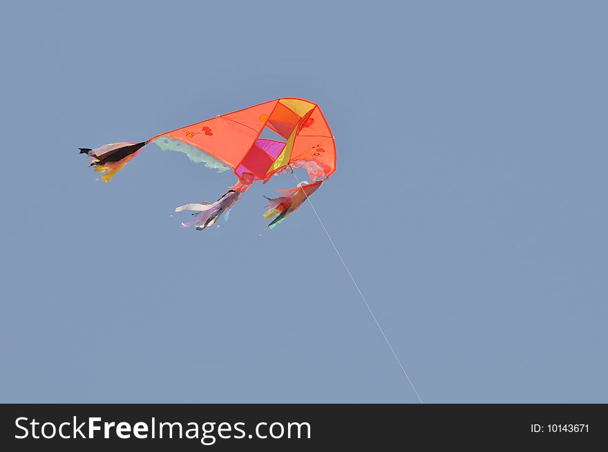 Colorful Kite flying on the blue sky background