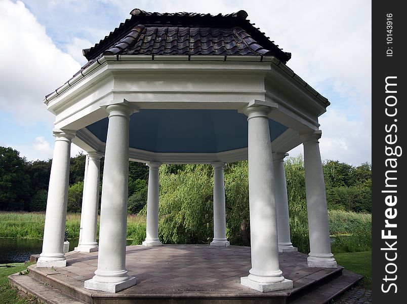 A gazebo alongside a small stream