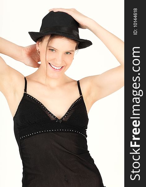 Portrait of young woman in black lingerie and hat, studio shot. Portrait of young woman in black lingerie and hat, studio shot