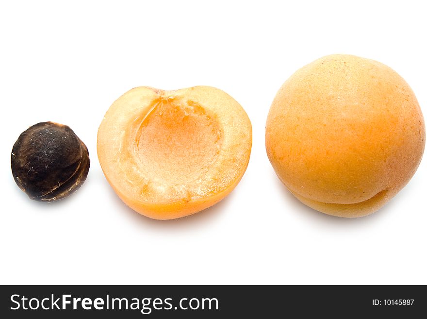 Ripe apricot unpitted on a white background. Ripe apricot unpitted on a white background