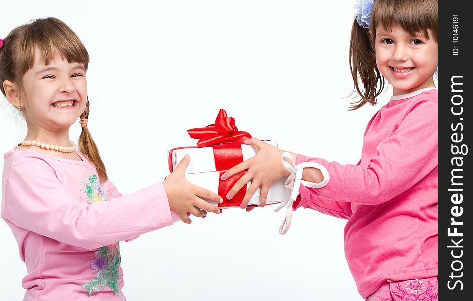 Little girls holding gift boxes