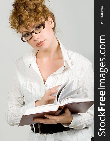 Attractive young lady reading book. Attractive young lady reading book