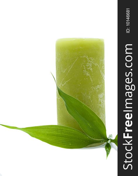 Green candle with bamboo leaf