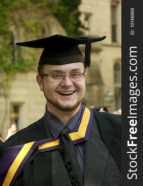 Portrait of happy graduate outdoors