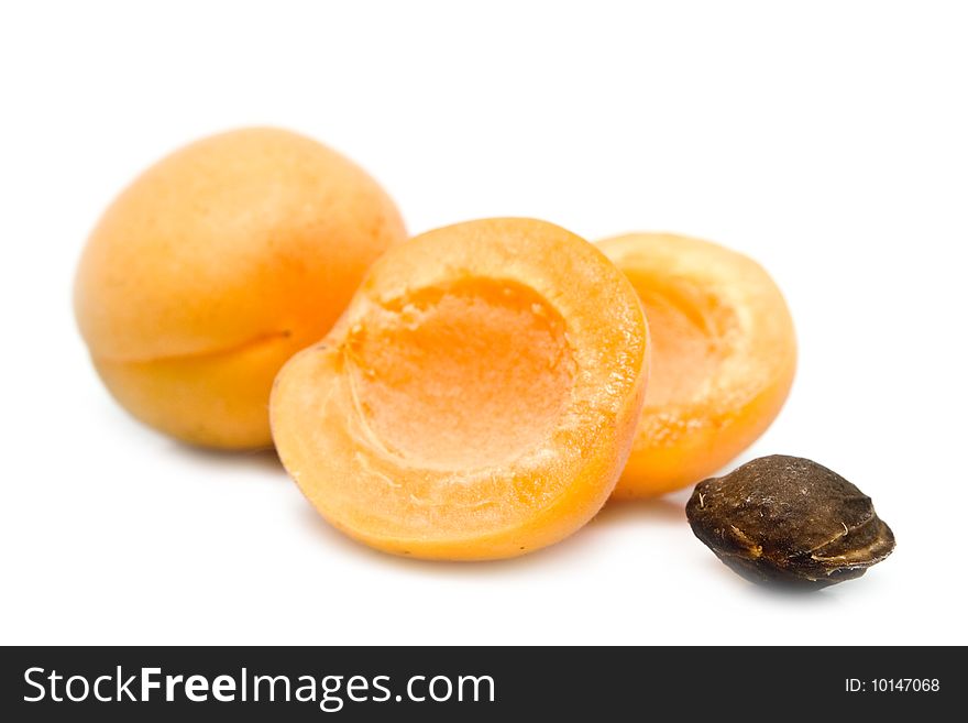 Ripe apricot unpitted on a white background. Ripe apricot unpitted on a white background