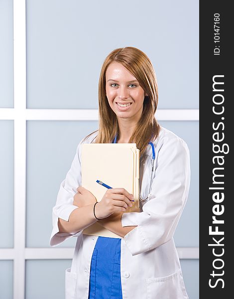 Woman doctor holding a chart in a modern office