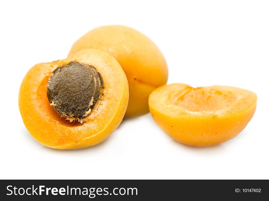 Ripe apricot unpitted on a white background. Ripe apricot unpitted on a white background