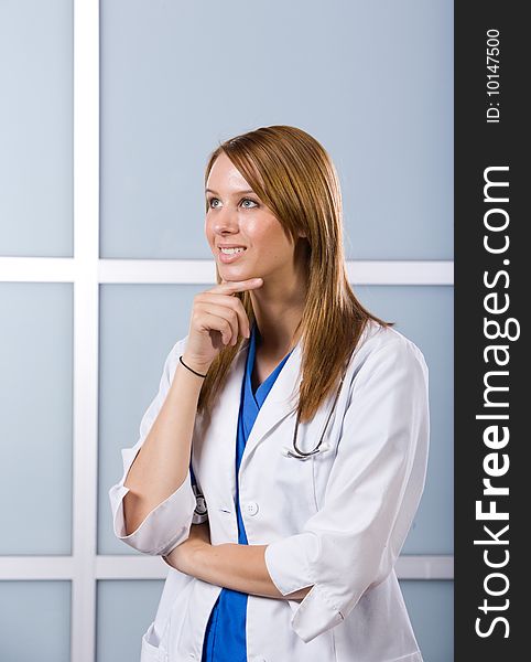 Young female doctor standing in a modern office