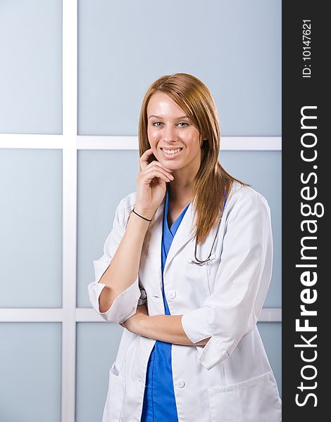 Young female doctor standing in a modern office