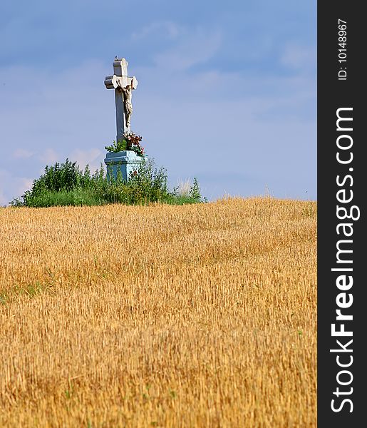 On a wheat field the cross