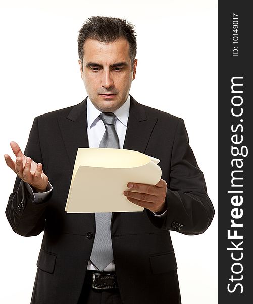 Businessman reads a document with query. Businessman reads a document with query