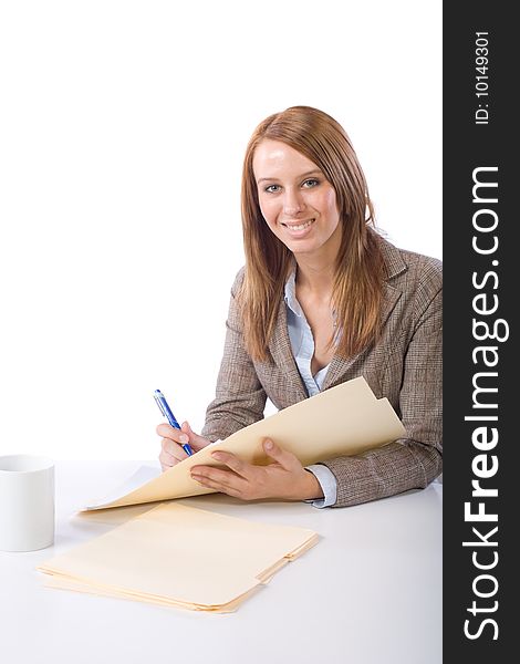 Business Woman Writing notes at desk