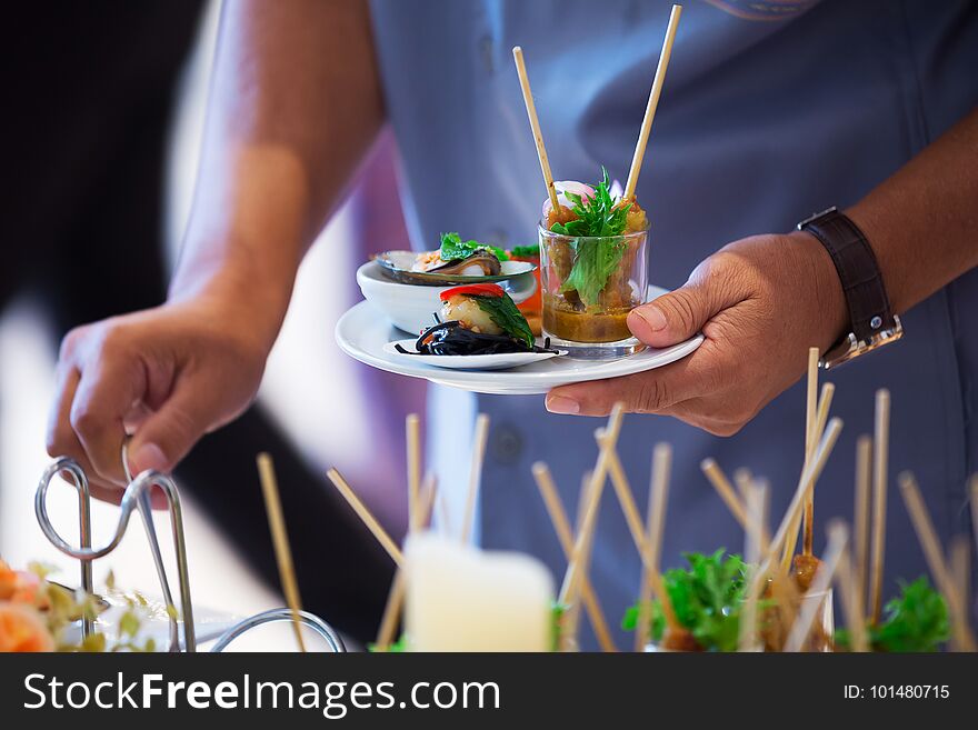 Catering - food plate and hand