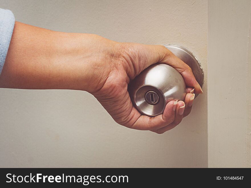 Asian Women Hand Open Door Knob