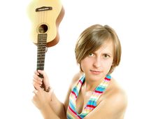 Angry Girl Fighting With A Guitar Royalty Free Stock Images