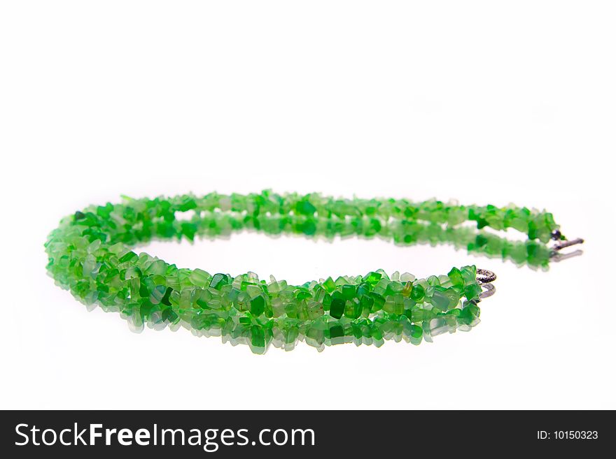 Green malachite necklace on white background. Green malachite necklace on white background