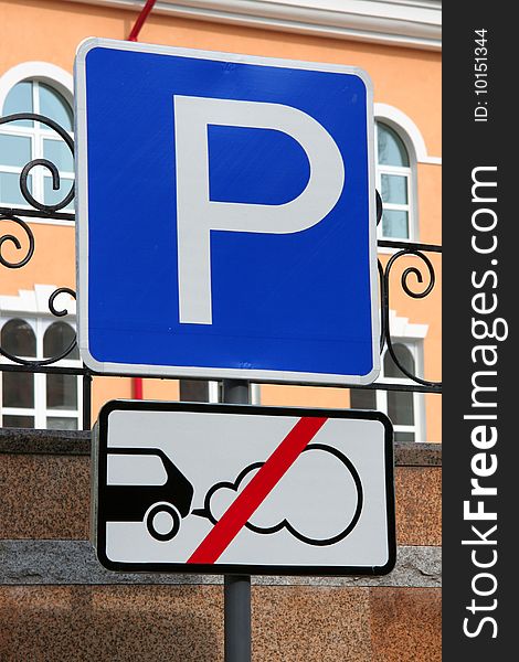 Two traffic signs in city street