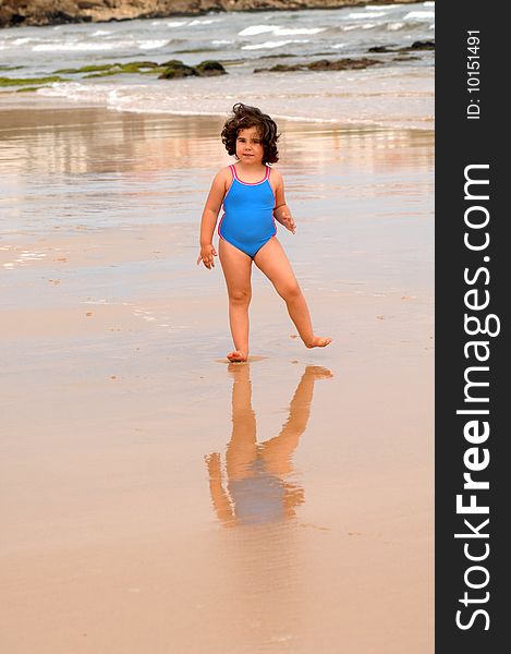 Cute Little Girl On The Beach