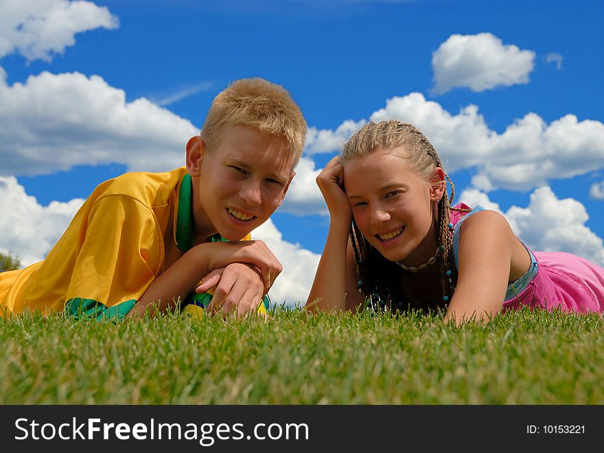 Brother and sister on grass area