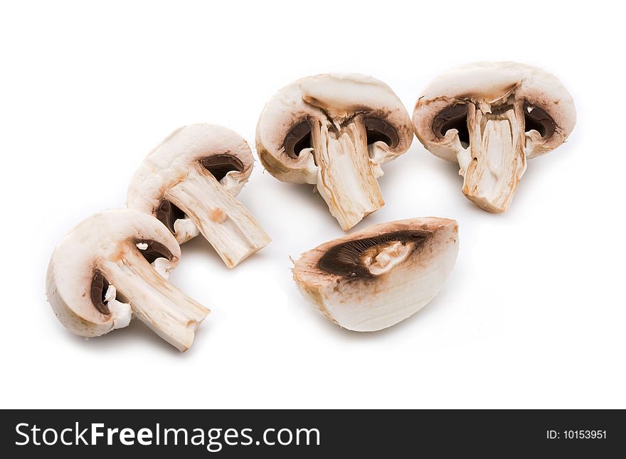 Fresh white mushrooms on a gray background