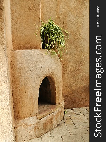 Traditional 0utdoor adobe fireplace found in Arizona