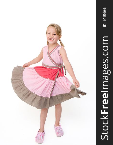 Young girl twirling around in her dress