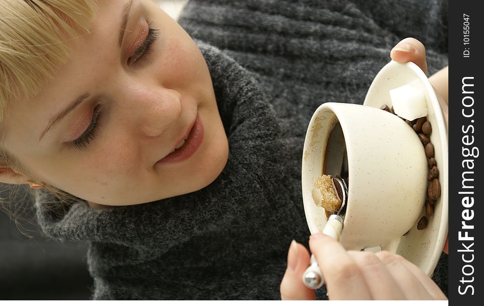 Beautiful young girl with a cup of hot coffee drink. Beautiful young girl with a cup of hot coffee drink