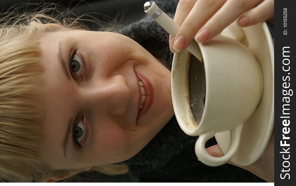 Beautiful young girl with a cup of hot coffee drink. Beautiful young girl with a cup of hot coffee drink