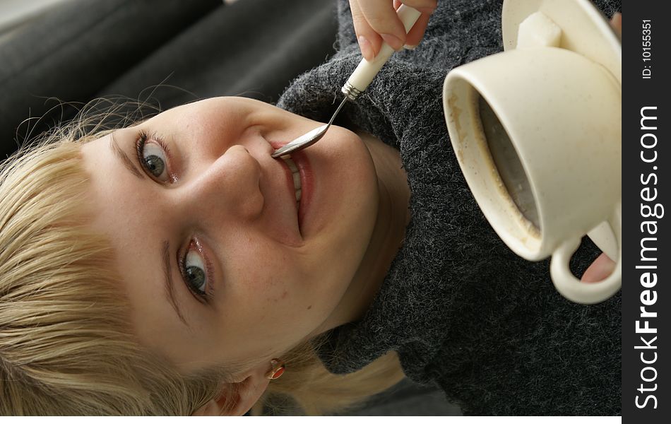 Beautiful young girl with a cup of hot coffee drink. Beautiful young girl with a cup of hot coffee drink