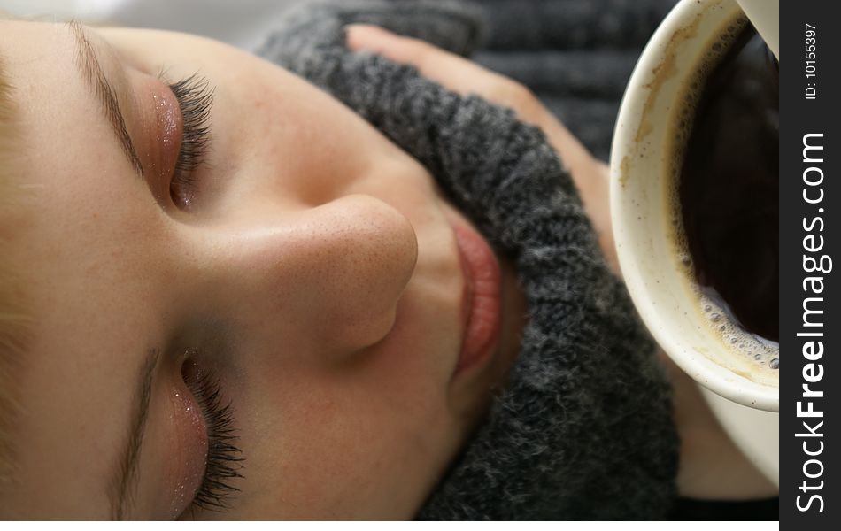 Beautiful young girl with a cup of hot coffee drink. Beautiful young girl with a cup of hot coffee drink