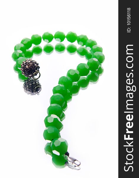 Green malachite necklace in the form of question mark. Green malachite necklace in the form of question mark