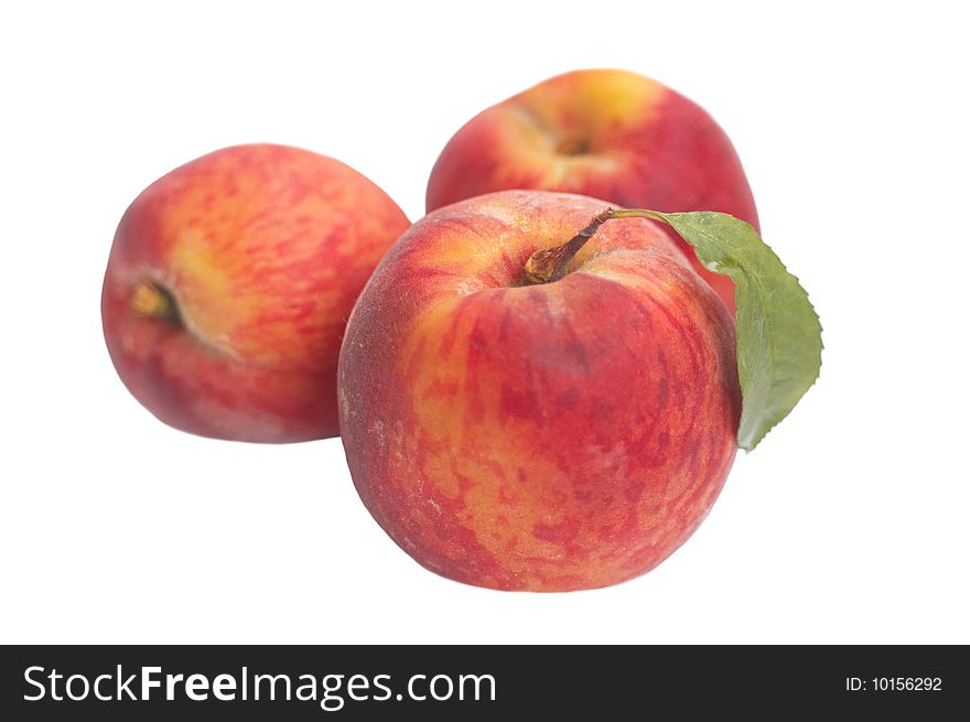 Three riped peaches isolated on white background