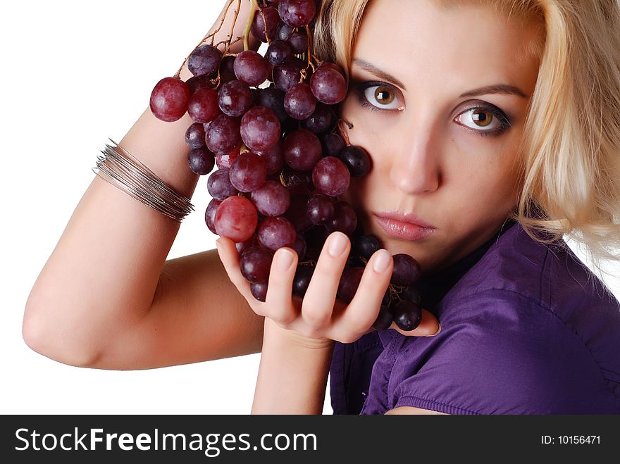 Portrait of a beautiful woman with bunch of grapes
