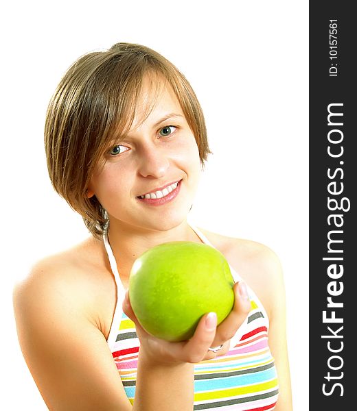 Portrait of an attractive Caucasian blond girl with a nice colorful striped dress who is smiling and she is holding a green apple in her hand. Isolated on white. Portrait of an attractive Caucasian blond girl with a nice colorful striped dress who is smiling and she is holding a green apple in her hand. Isolated on white.