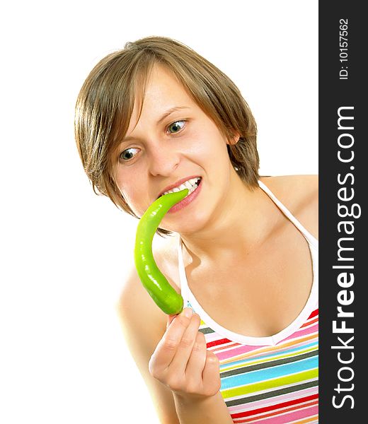 Cute girl going crazy with a green chilly