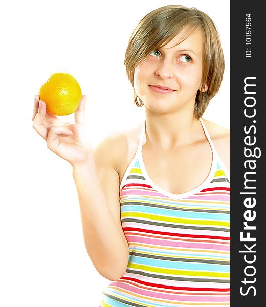 Portrait of a cute Caucasian blond girl with a nice colorful striped dress who is smiling and she is holding a fresh orange in her hand. Isolated on white. Portrait of a cute Caucasian blond girl with a nice colorful striped dress who is smiling and she is holding a fresh orange in her hand. Isolated on white.